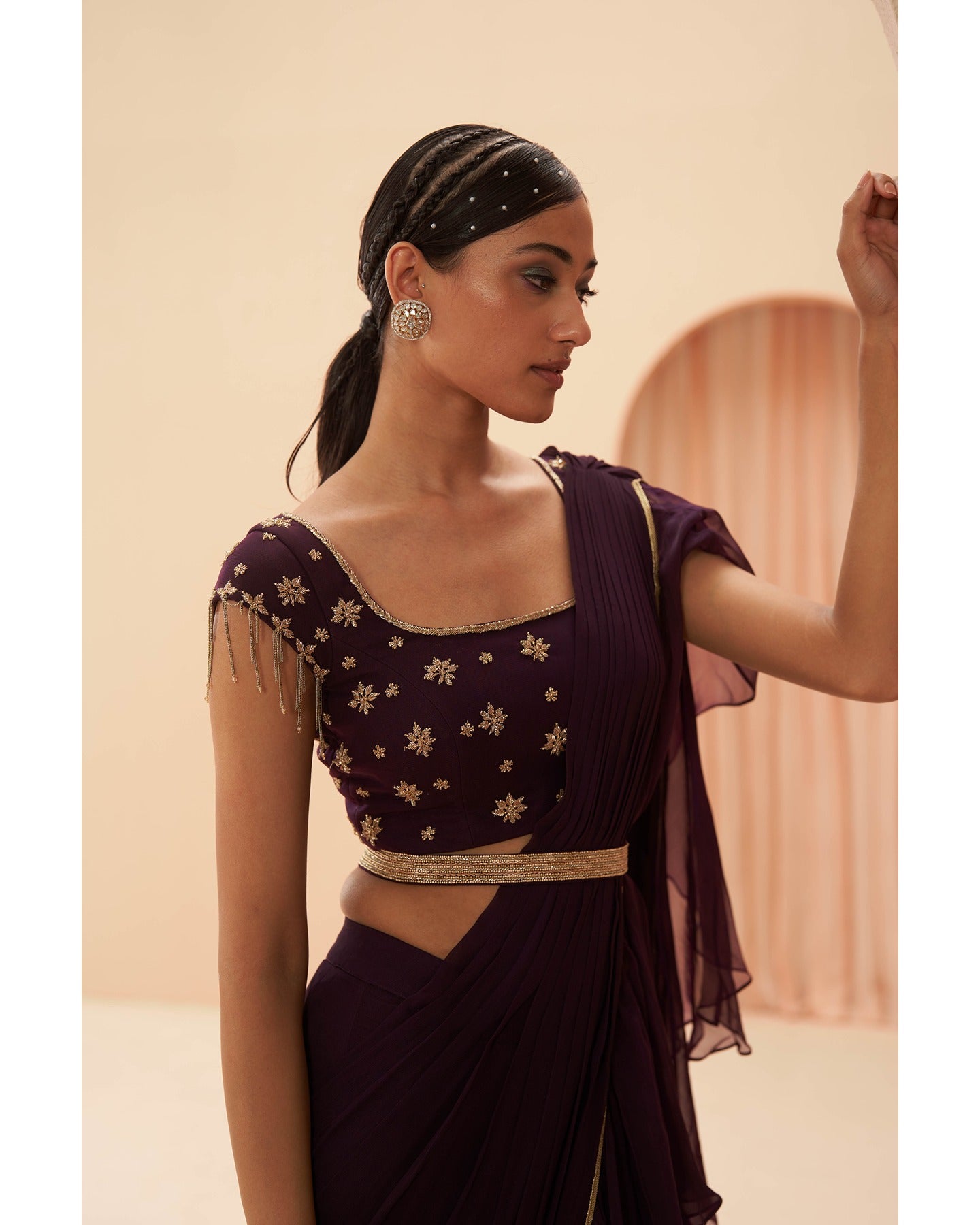 Wine Elegance Unveiled: Hand-embroidered details grace this deep wine drape saree, a symphony of sophistication and allure.