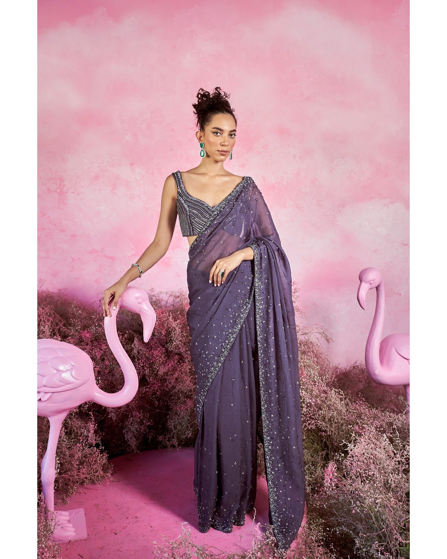 Purple Hues of Elegance: Adorning hand-embroidery, this saree set weaves a tapestry of sophistication in every stitch. 