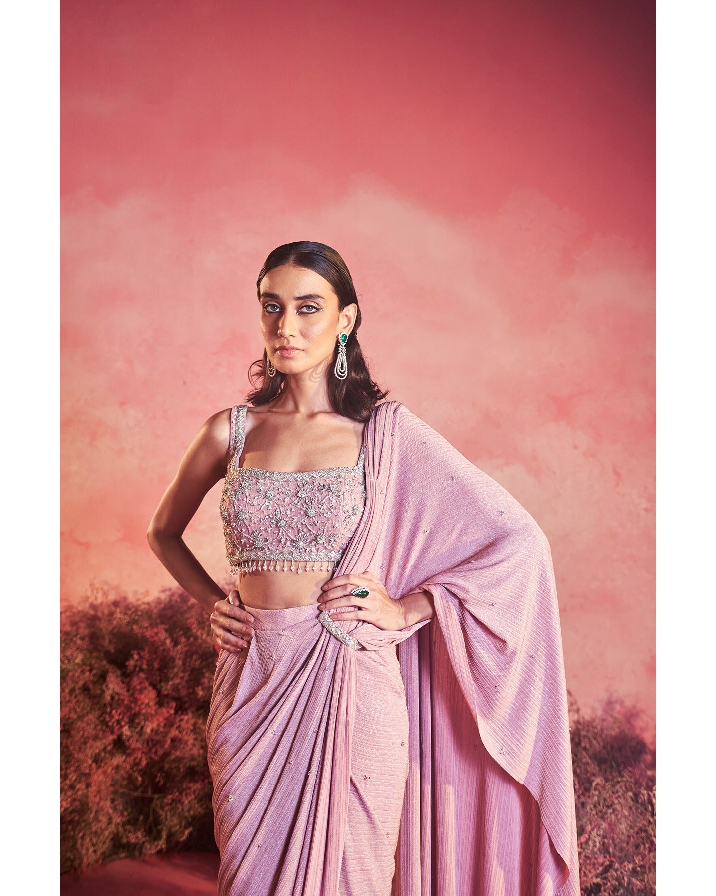 Pretty in Pink Drapes: Elegance unfolds with every sway, adorned in this enchanting pink drape saree. 