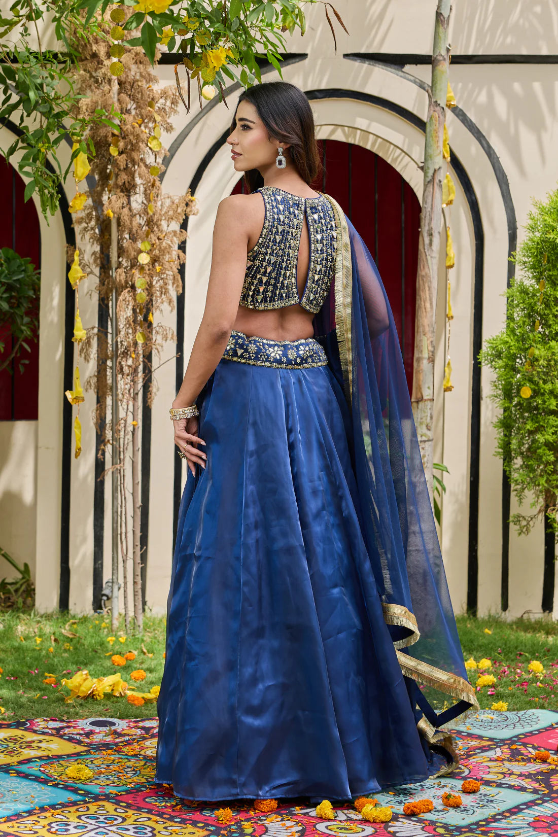 Navy blue blouse and shimmer organza lehenga set