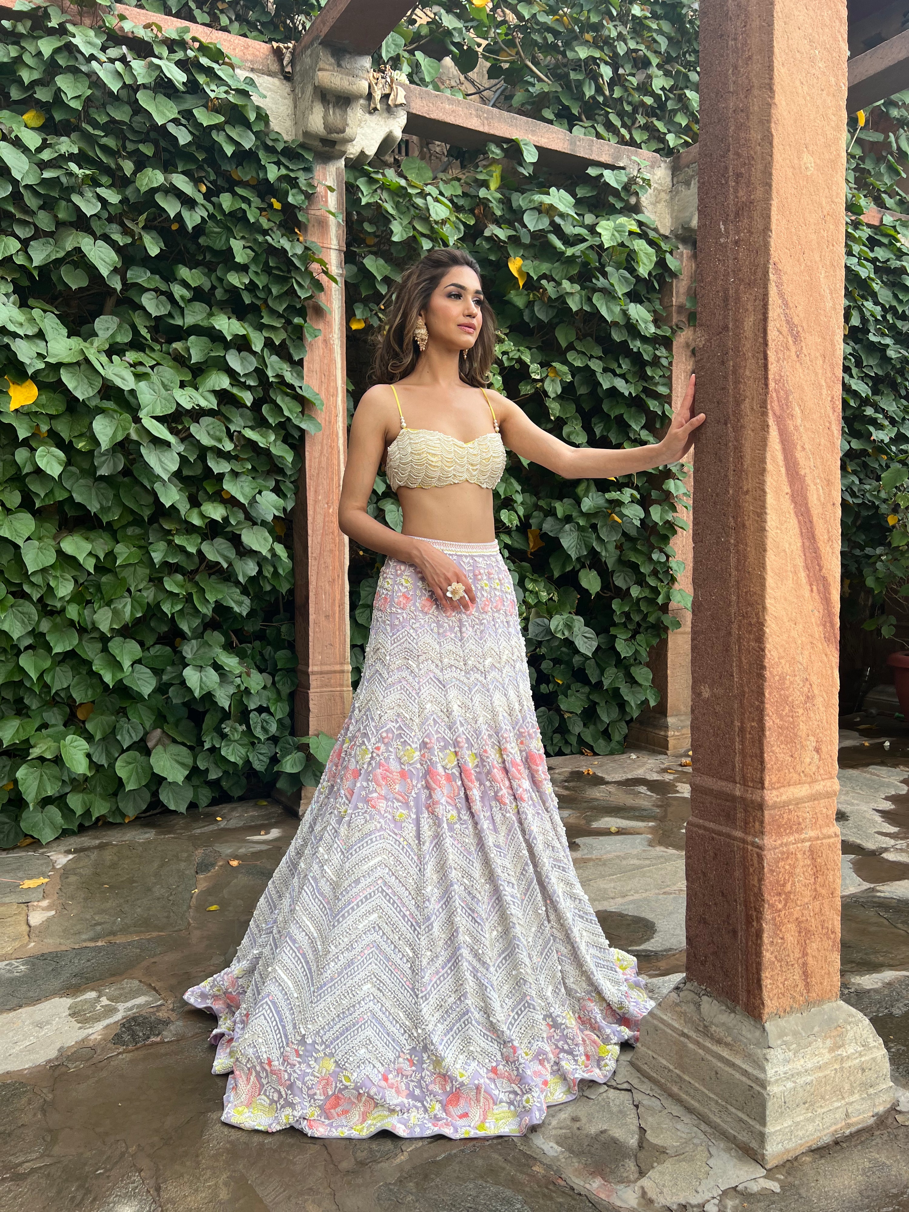 Sparkling Alara Mermaid Lehenga with crystal tassels on the choli and a breathtaking chevron and floral metallic georgette lehenga, perfect for a fairytale bridal look.