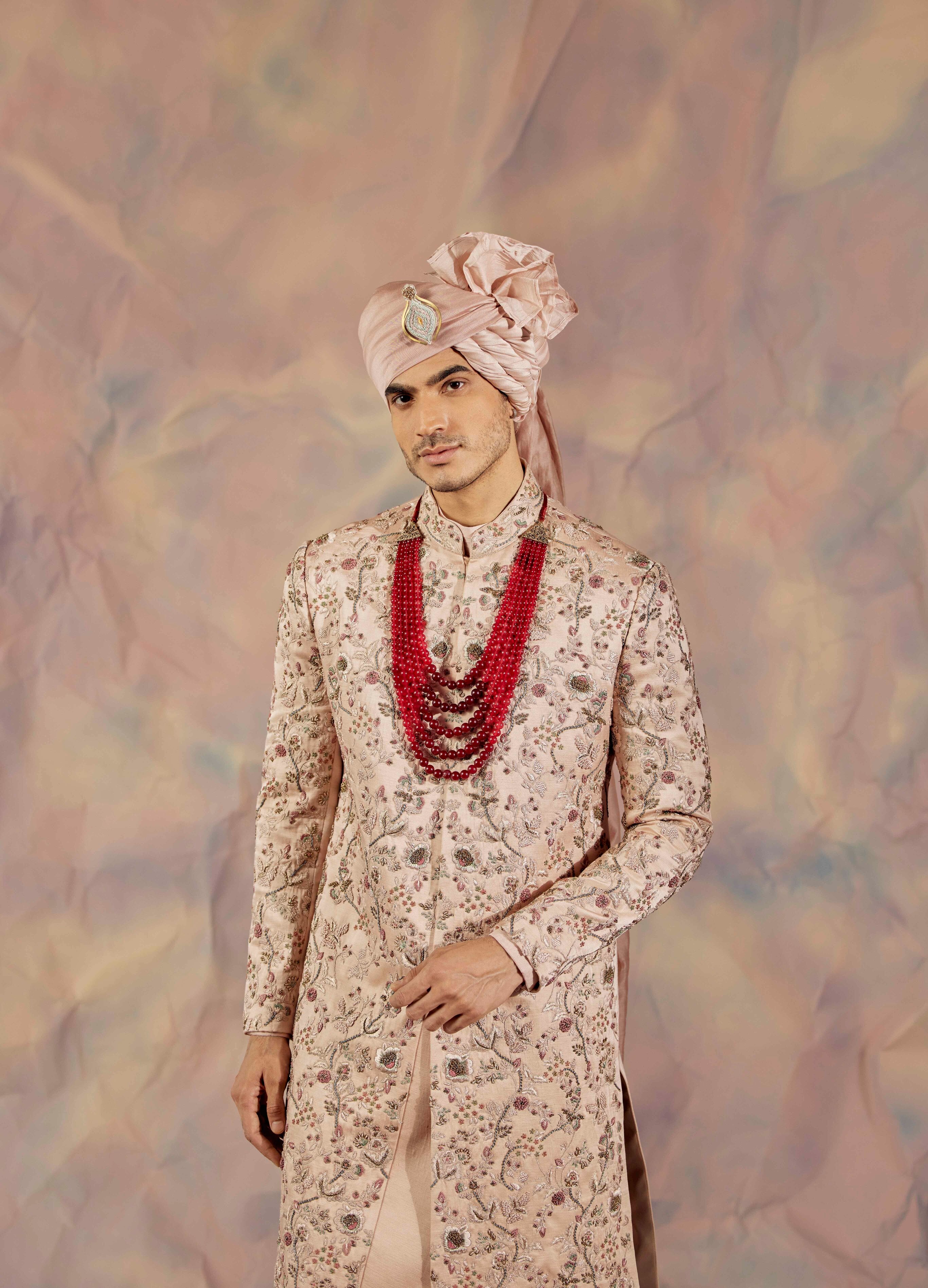 Embrace luxury with the Blush Pink Sherwani Set.