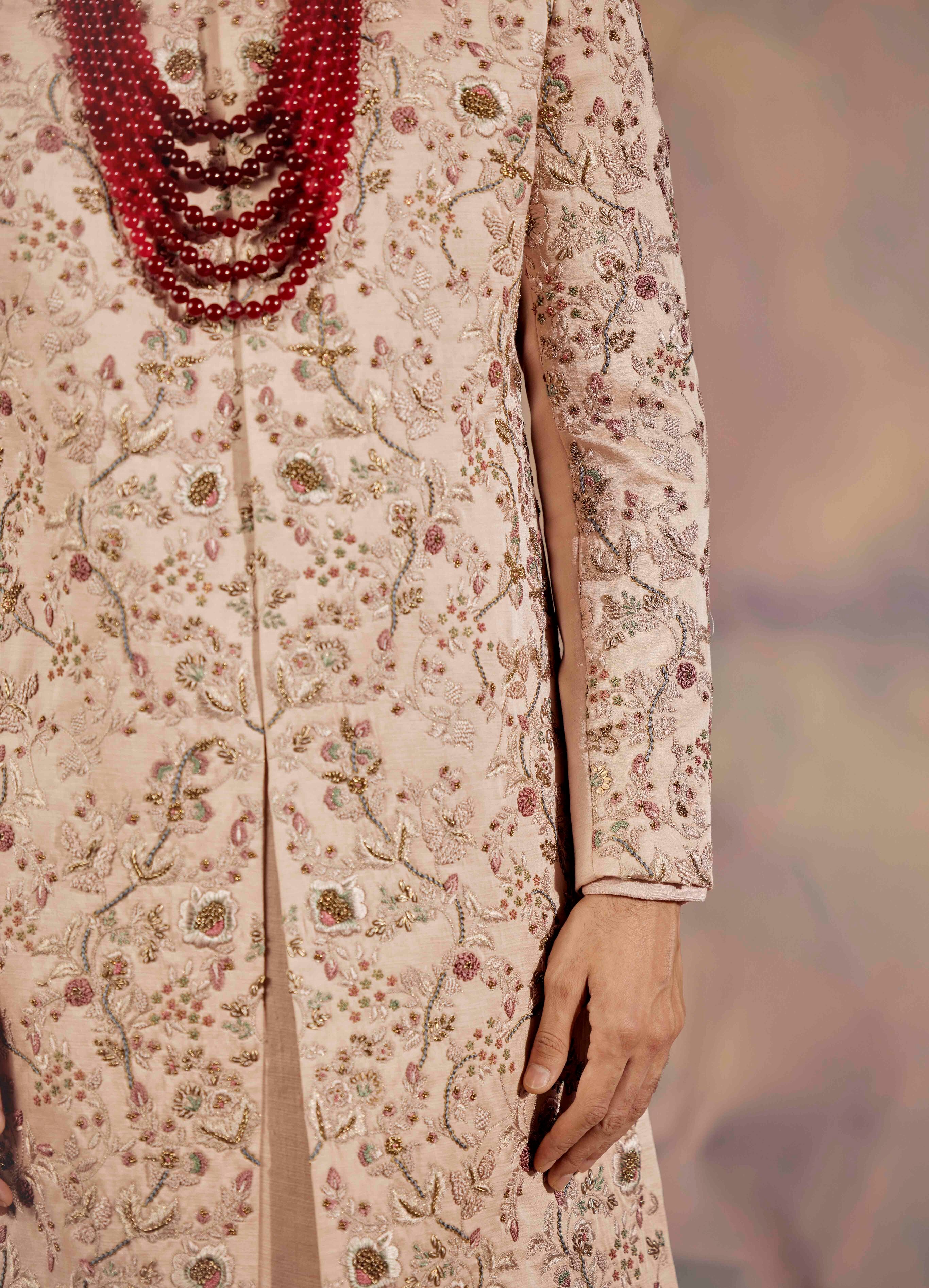 Celebrate in timeless style with the Blush Pink Sherwani Set