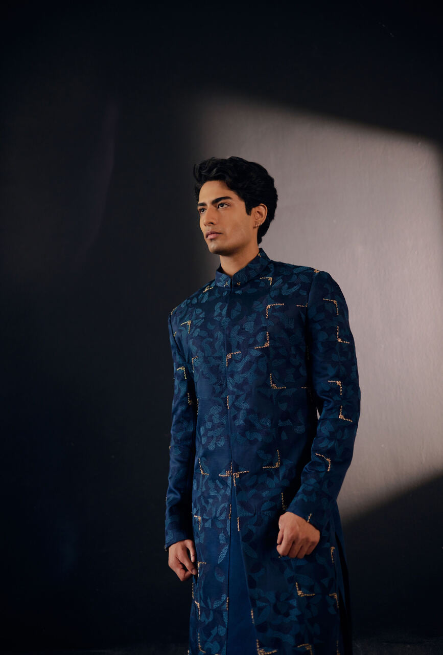 Distinguished Blue Sapphire Sherwani: Elevate your style with royal charm.