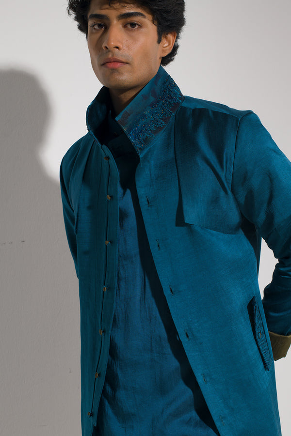 Shift your style into high gear with our Tilted Teal Shacket – where sophistication meets edge.