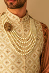 Luxurious Ivory Tan Sherwani Set: Crafted for the distinguished gentleman.