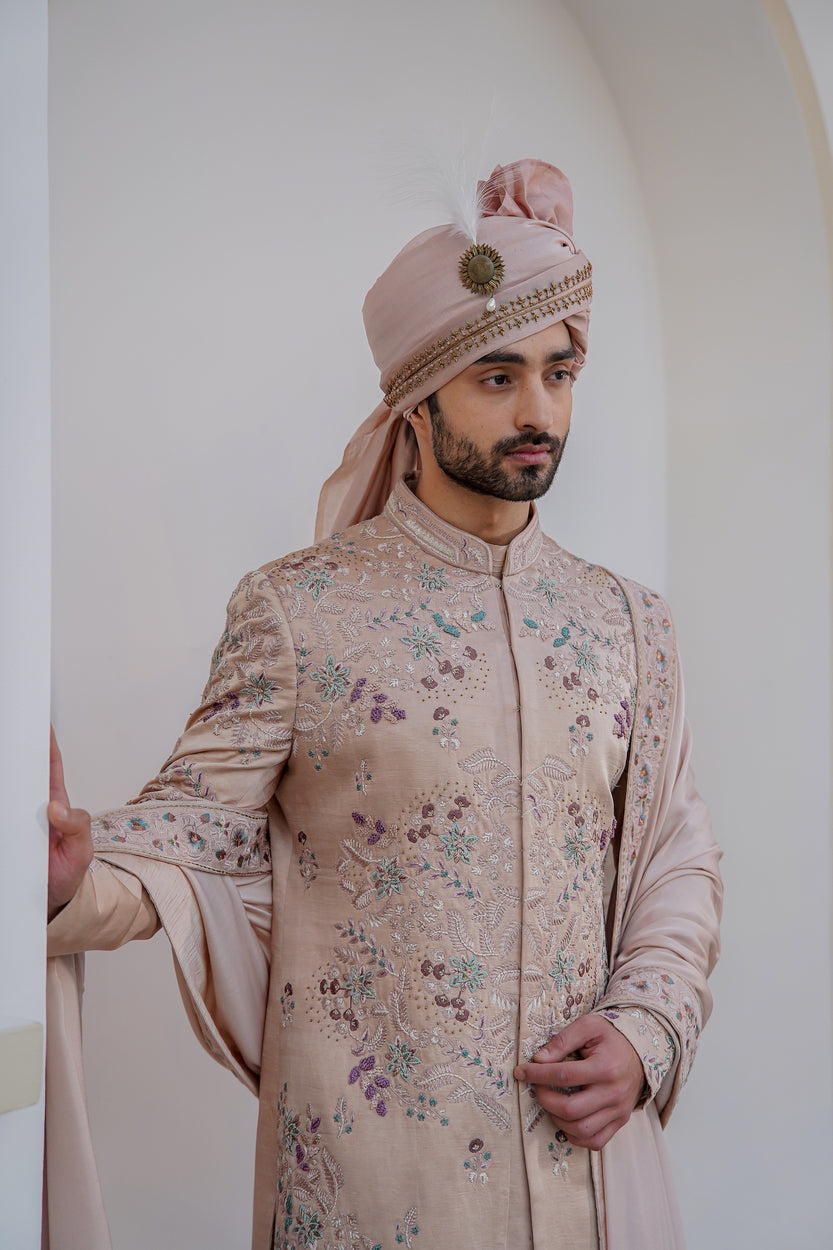Experience the blend of tradition and modernity with the Blush In JMC sherwani. 
