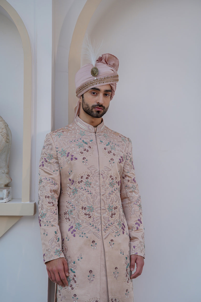 Crafted with intricate embroidery, the Blush In JMC sherwani is a masterpiece of design and craftsmanship. 