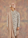 Step into regal elegance with the Silver Lining Sherwani Set.