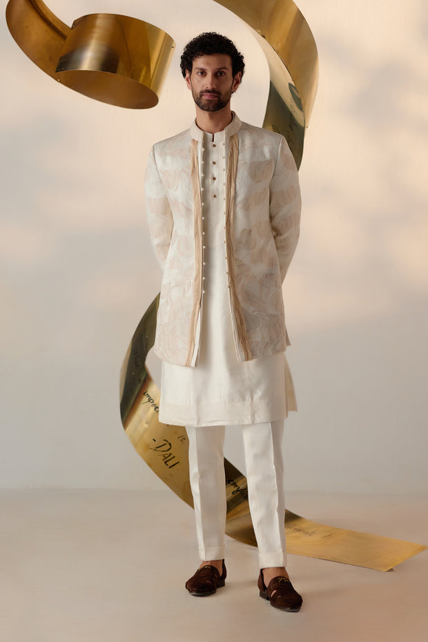 Elegant model wearing a Dreamy Ivory Bandhgala Set, showcasing intricate embroidery.