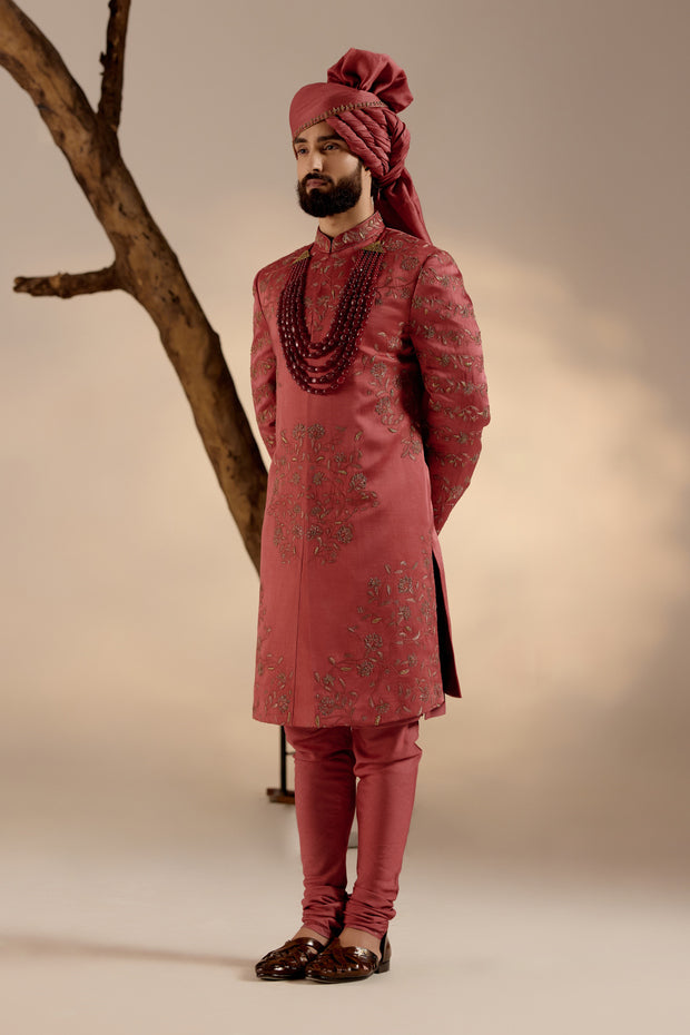 Full view of the Red Ochre Sherwani on a mannequin, highlighting its refined and regal silhouette