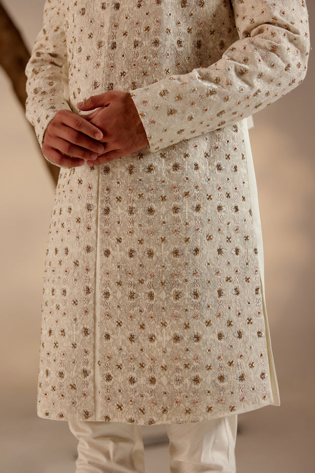 Full view of the Albino White Sherwani on a mannequin, highlighting its refined and elegant silhouette