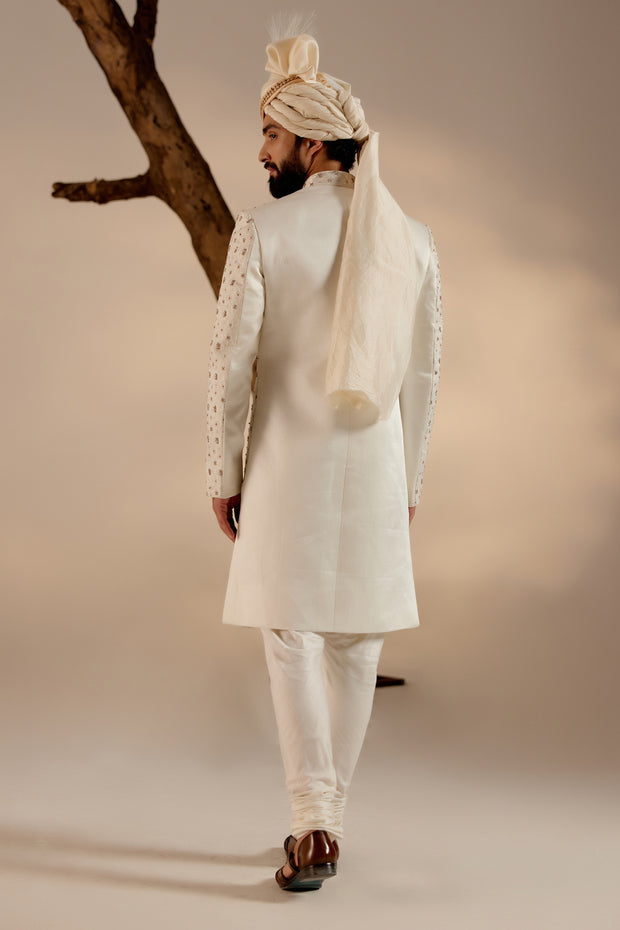 Back view of the Albino White Sherwani, featuring understated embellishments and a tailored fit.