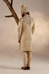 Back view of the Sand Ridge Sherwani, featuring understated embellishments and a tailored fit.