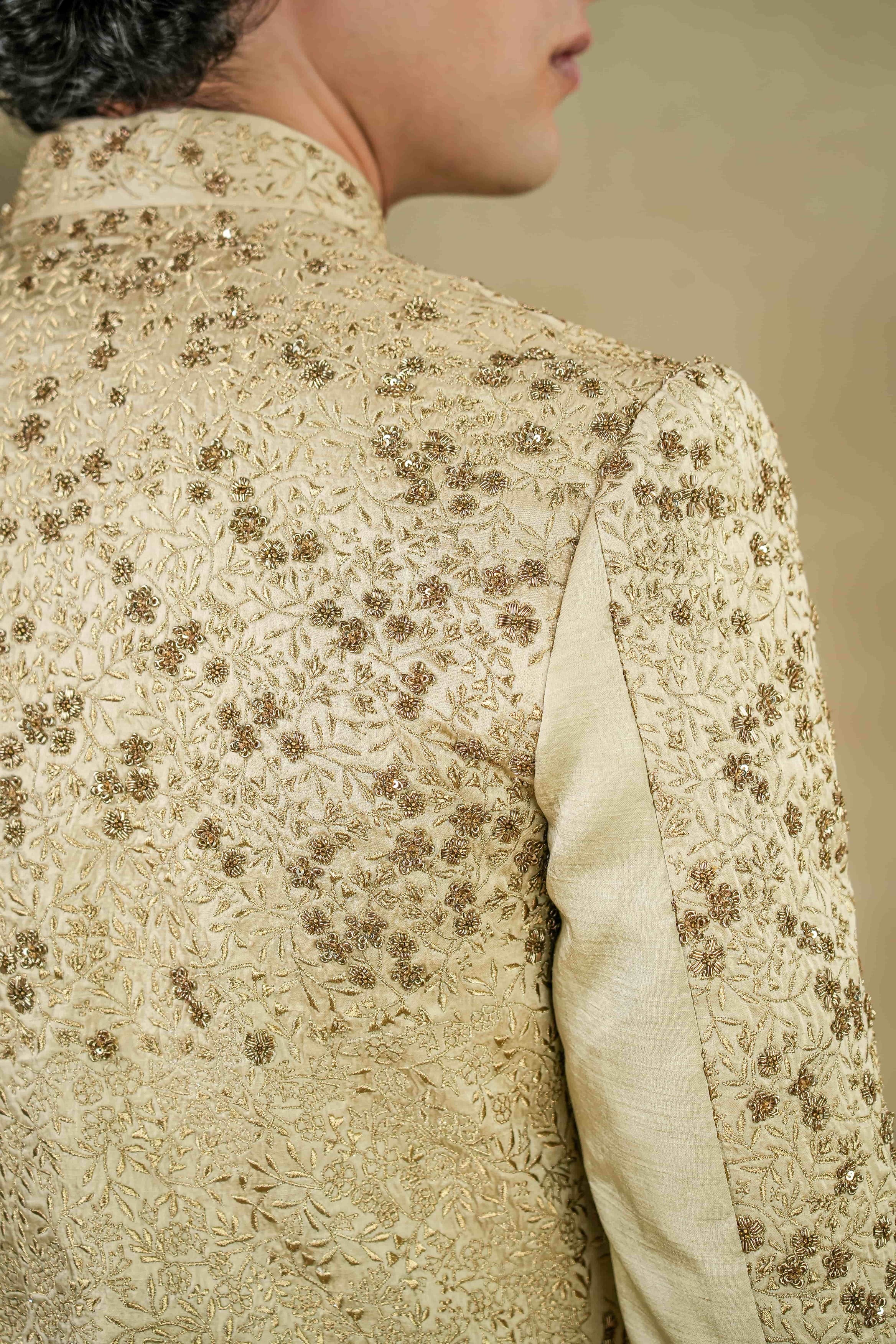 Back view of the Sandune Sherwani, showcasing detailed embroidery and a tailored fit.