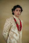 Close-up of the Butter Cream Sherwani, showcasing intricate detailing and fine craftsmanship
