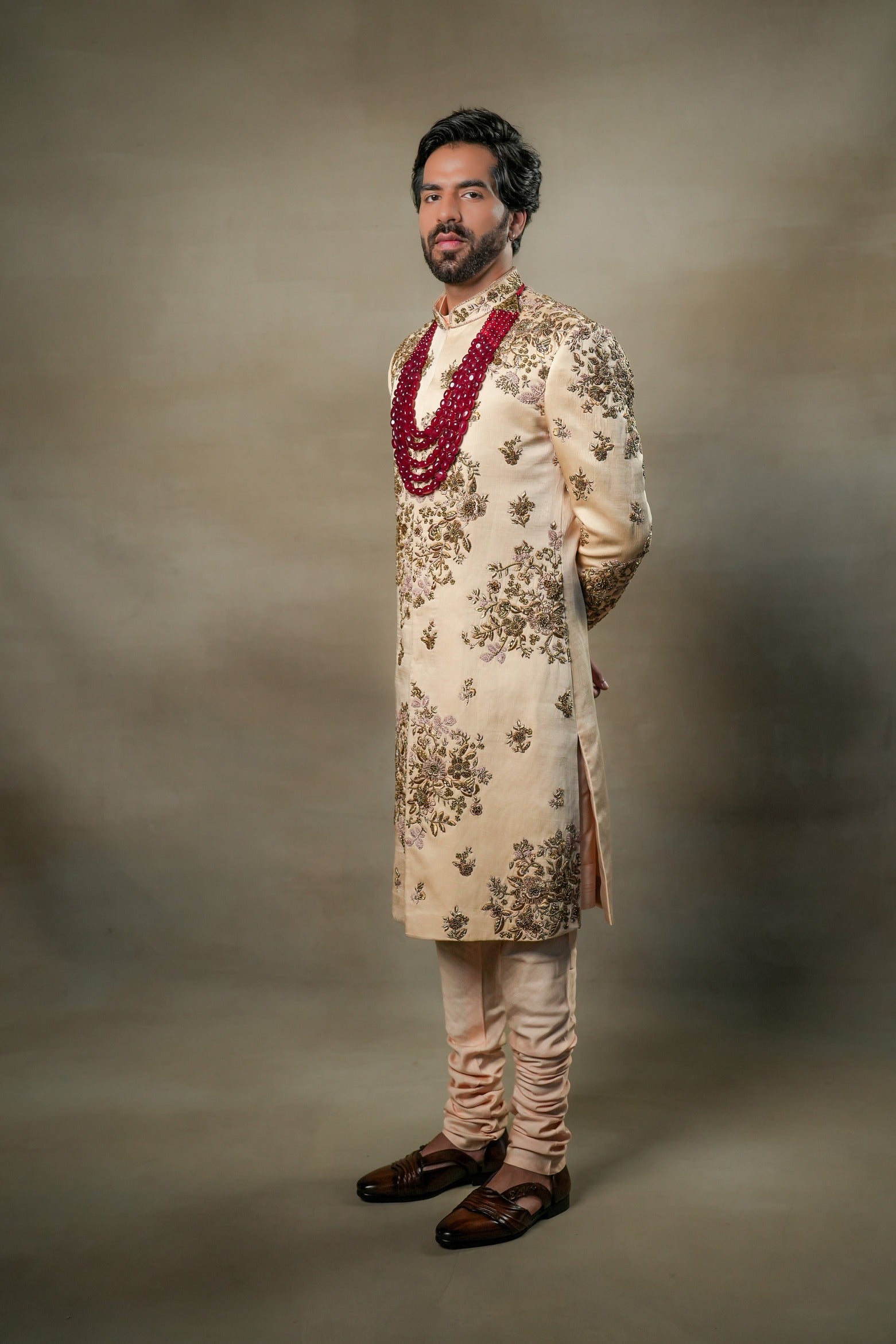Side profile of the Frosted Almond Sherwani, displaying the luxurious fabric and subtle texture.