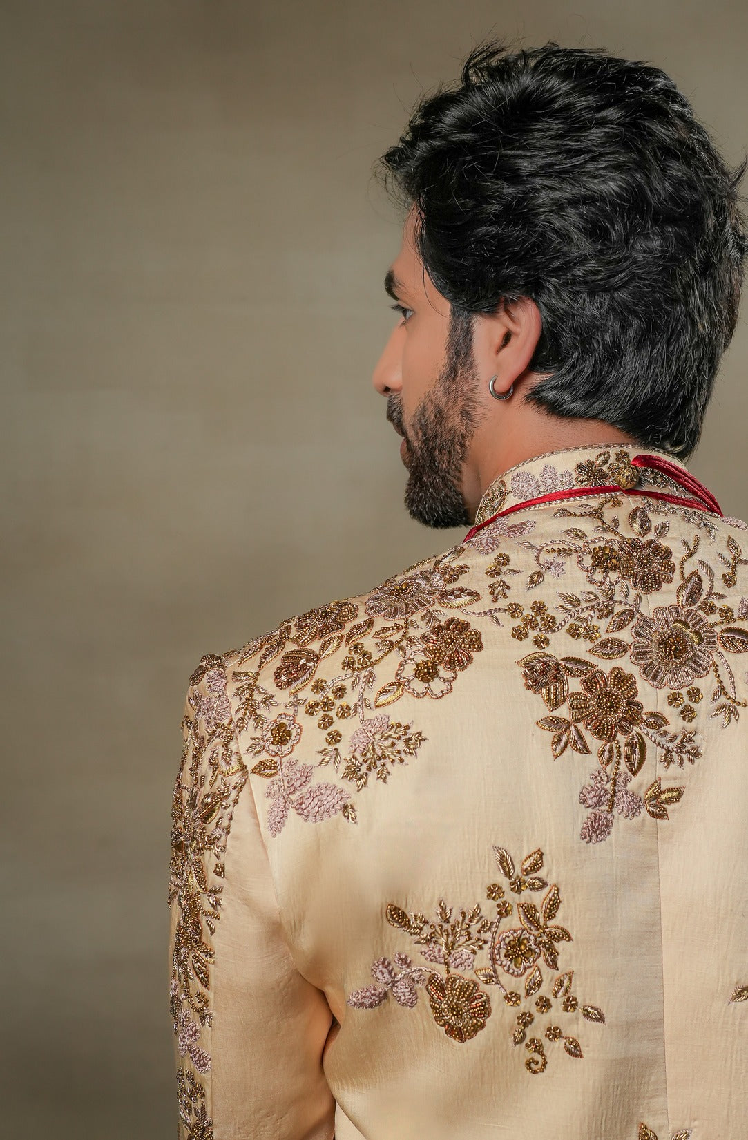 Back view of the Frosted Almond Sherwani, featuring understated embellishments and a tailored fit.