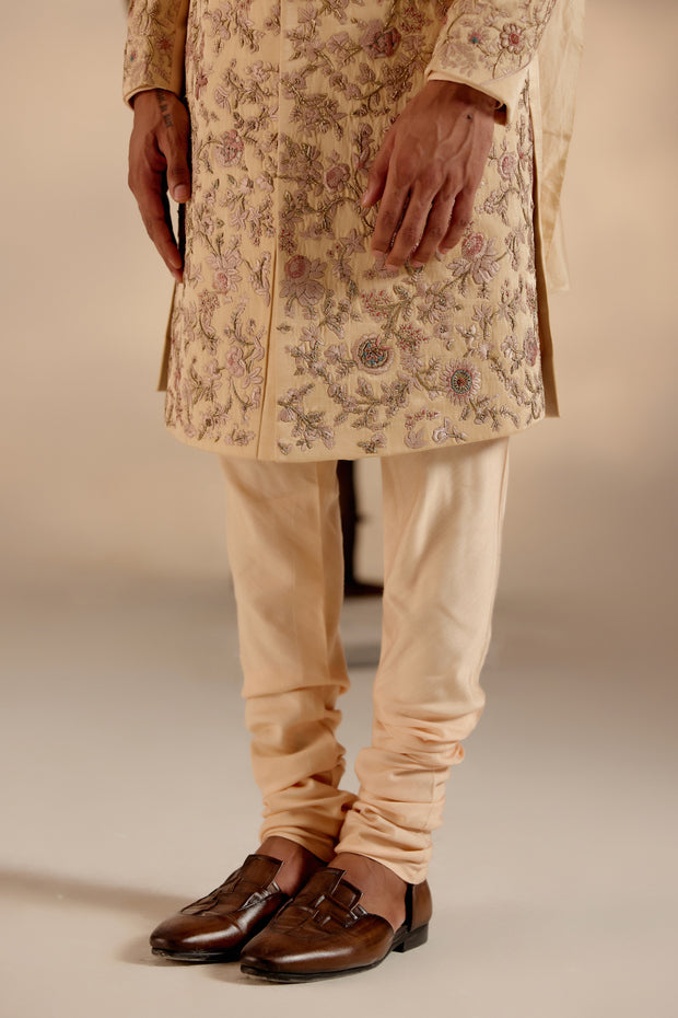 Front view of the Pale Gold Sherwani, blending traditional craftsmanship with modern grandeur