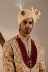 Full view of the Pale Gold Sherwani on a mannequin, highlighting its regal and majestic silhouette.