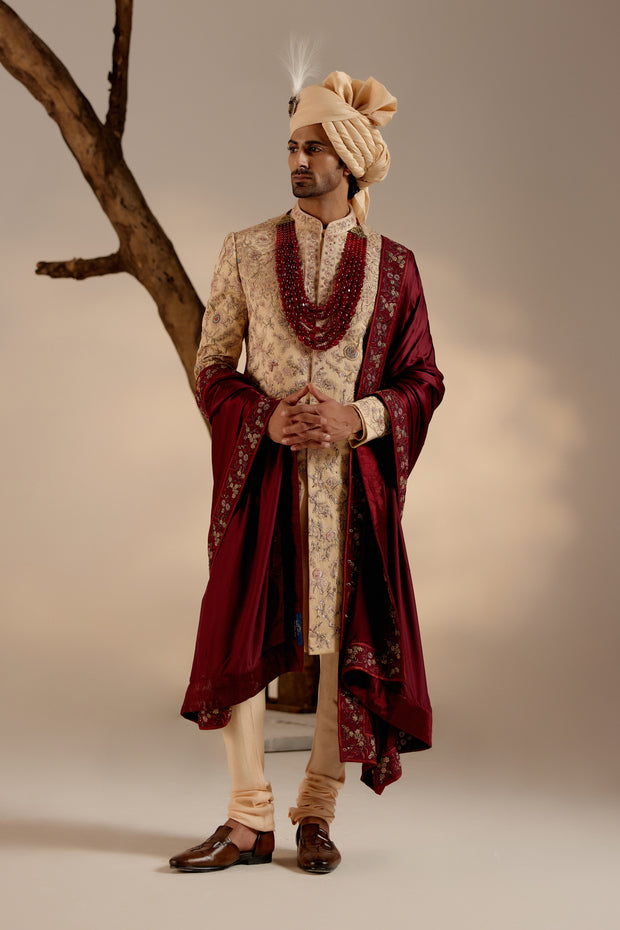 Full view of the Pale Gold Sherwani on a mannequin, highlighting its regal and majestic silhouette.