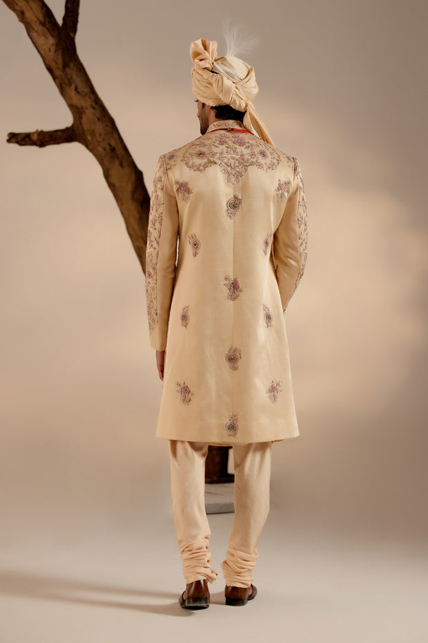 Back view of the Pale Gold Sherwani, featuring ornate embellishments and a tailored fit