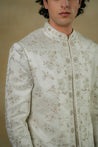 Close-up of the Gardenia White Sherwani, revealing intricate embroidery and delicate detailing.