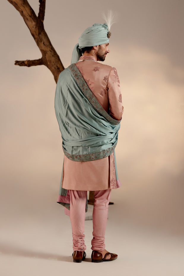 Back view of the Orchid Pink Sherwani, featuring understated embellishments and a tailored fit