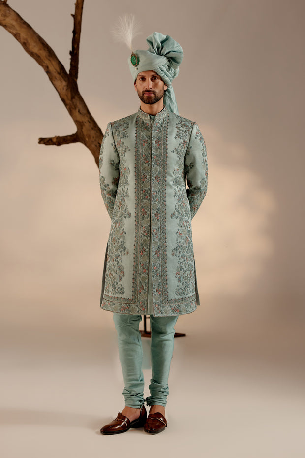 Introducing our exquisite heavy hand-embroidered sherwani in chateau grey, a true testament to timeless elegance and sophistication.