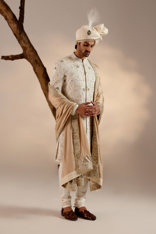 Presenting our masterpiece: the white all-over hand-embroidered sherwani set, a true epitome of elegance and craftsmanship