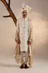 Presenting our masterpiece: the white all-over hand-embroidered sherwani set, a true epitome of elegance and craftsmanship