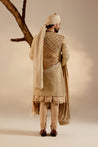 Introducing our exquisite sand grey all-over hand-embroidered sherwani set, a true work of art.
