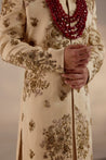 Introducing our masterpiece: the golden placement hand-embroidered sherwani. 
