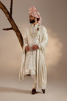 Introducing our exquisite white all-over hand-embroidered sherwani set, a pinnacle of sophistication and grace