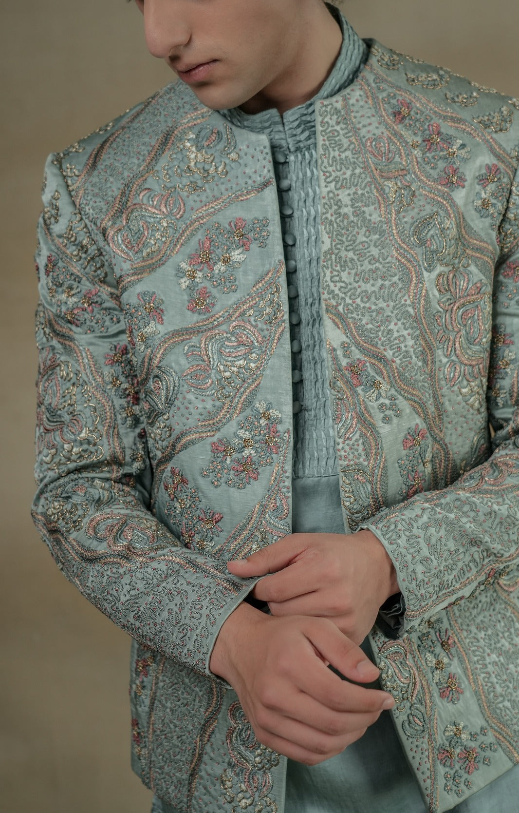 Introducing our exquisite chateau grey hand-embroidered short jacket set, a true work of art.
