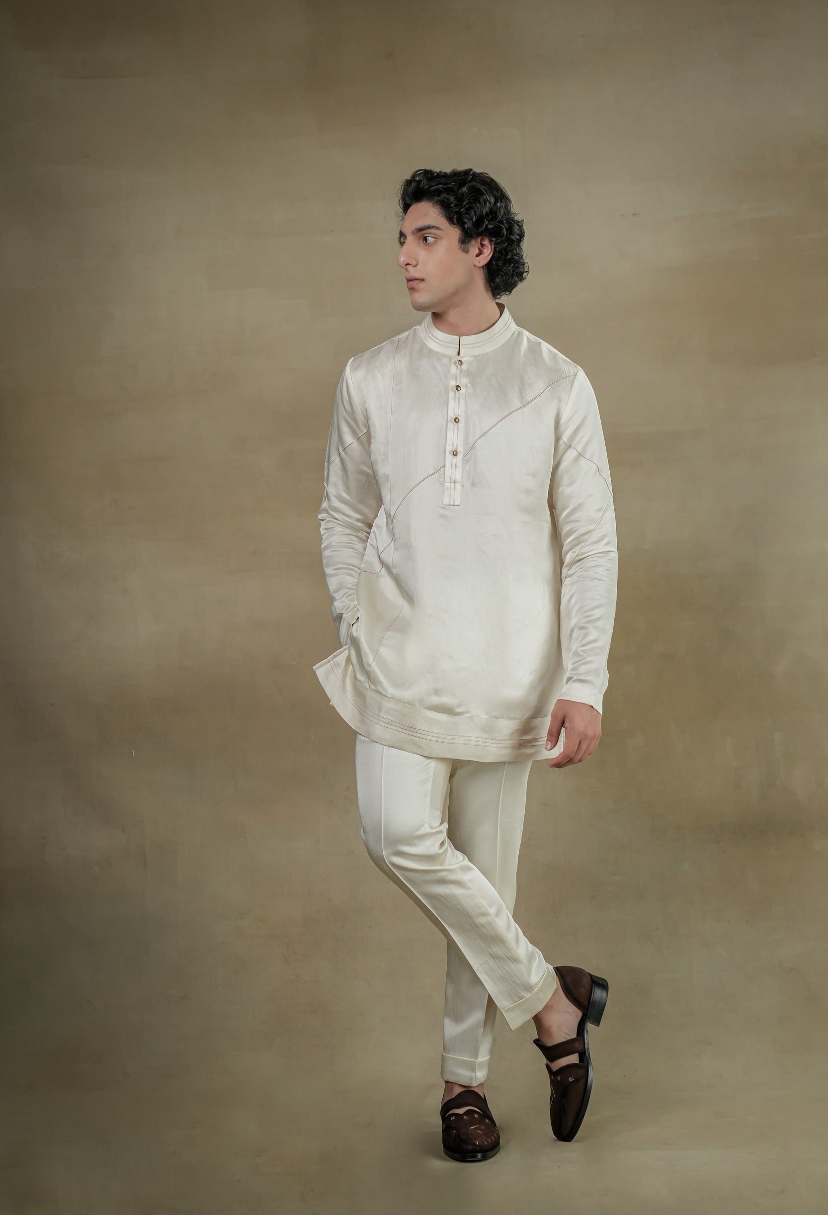 dirty ivory Linen Silk front potli button kurta, adorned with exquisite contrast color thread detailing for a touch of refinement