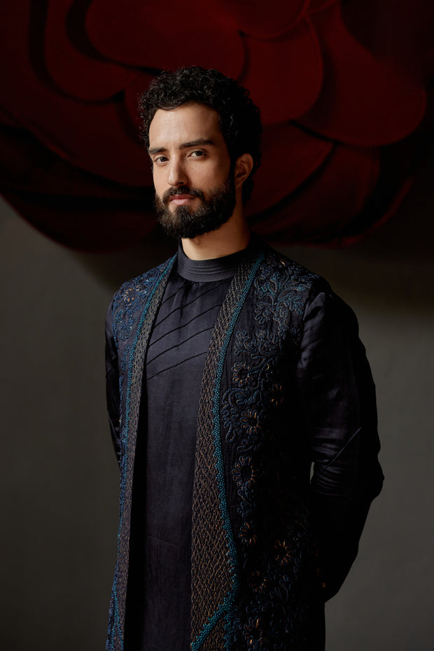 Stylish John Wane shrug set comprising a button-up shirt and tailored trousers, accessorized with a mid-length shrug adorned with fringe details.