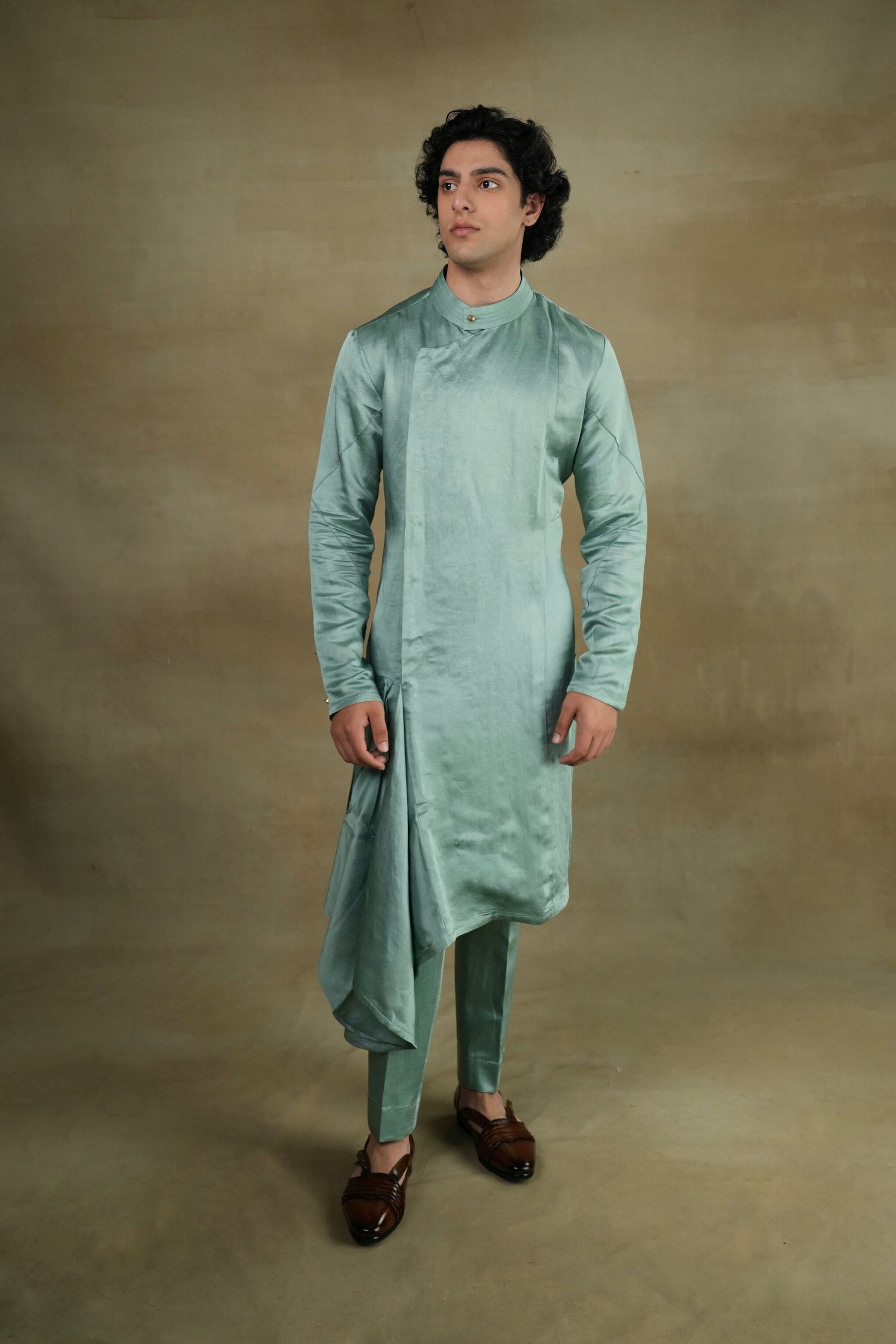 Elegant Chateau Drape Kurta Set featuring a draped tunic with intricate embroidery, paired with matching trousers for a regal and sophisticated ensemble.