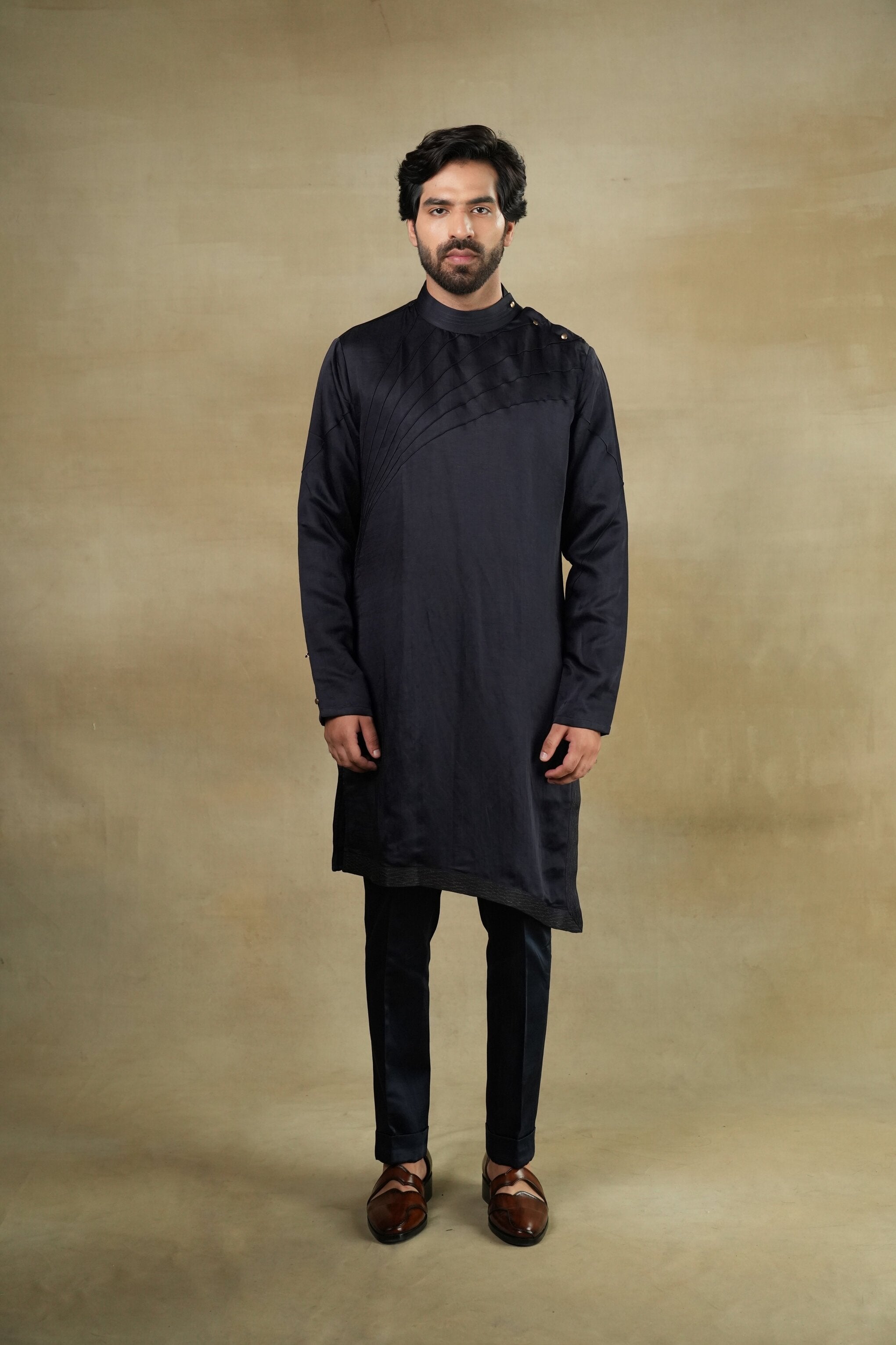 Elegant Midnight Wane Kurta Set featuring a dark blue kurta with intricate golden embroidery, paired with matching trousers for a sophisticated and regal look