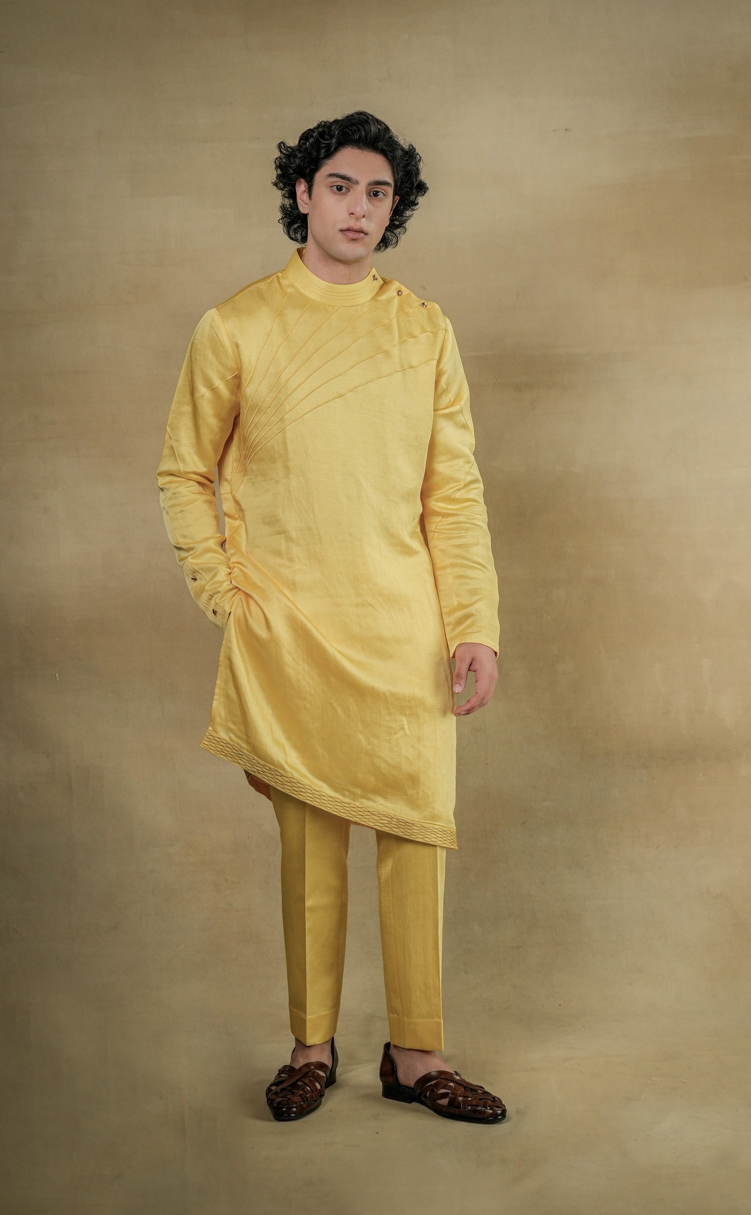 Bright and cheerful Lemon Yellow Kurta Set featuring a traditional kurta adorned with intricate embroidery, paired with matching trousers for a vibrant and festive ensemble