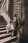 Ivory sherwani set with meadow flower design in light gold zari and pitta work, paired with a tone-on-tone kurta, churidar, stole, and safa