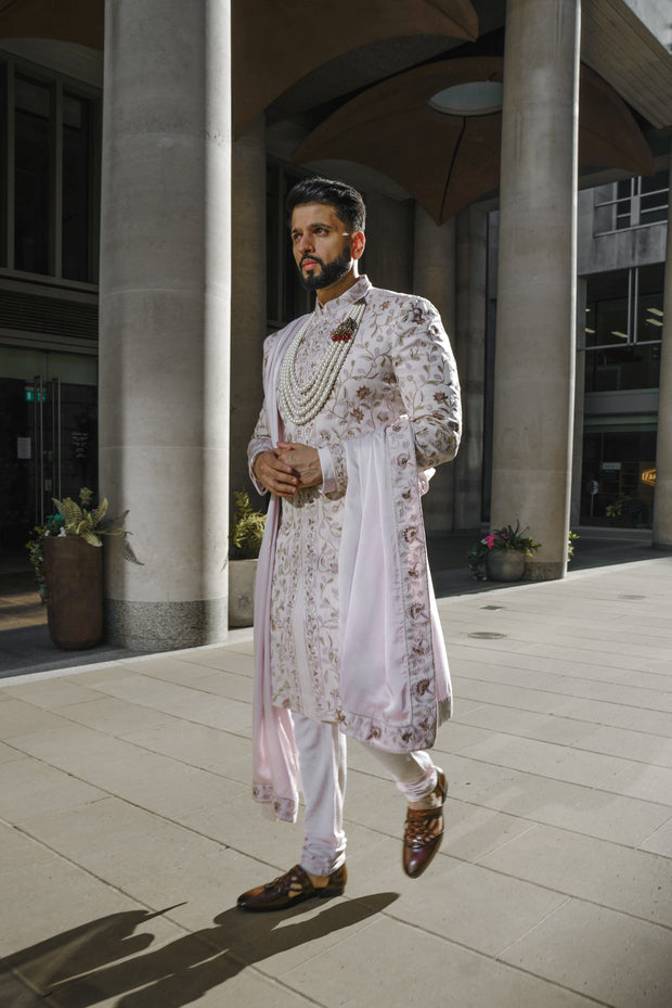 Complete Lilac Blush sherwani set paired with a tone-on-tone kurta, churidar, stole, and safa, creating an elegant and coordinated look