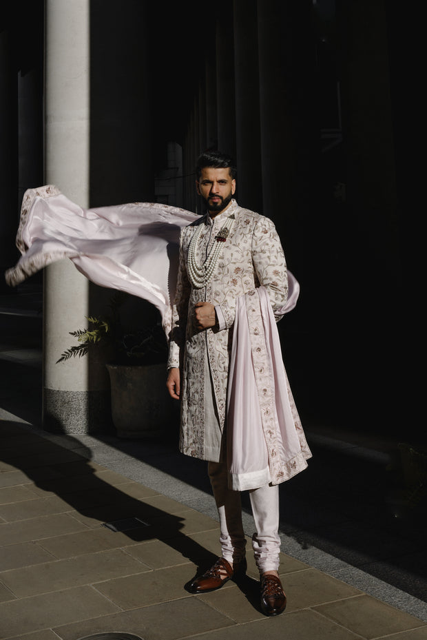 Front view of the Lilac Blush sherwani, featuring a unique blend of grey and lilac hues inspired by Monet's color palette, with intricate hand-embroidered aari and zardozi work