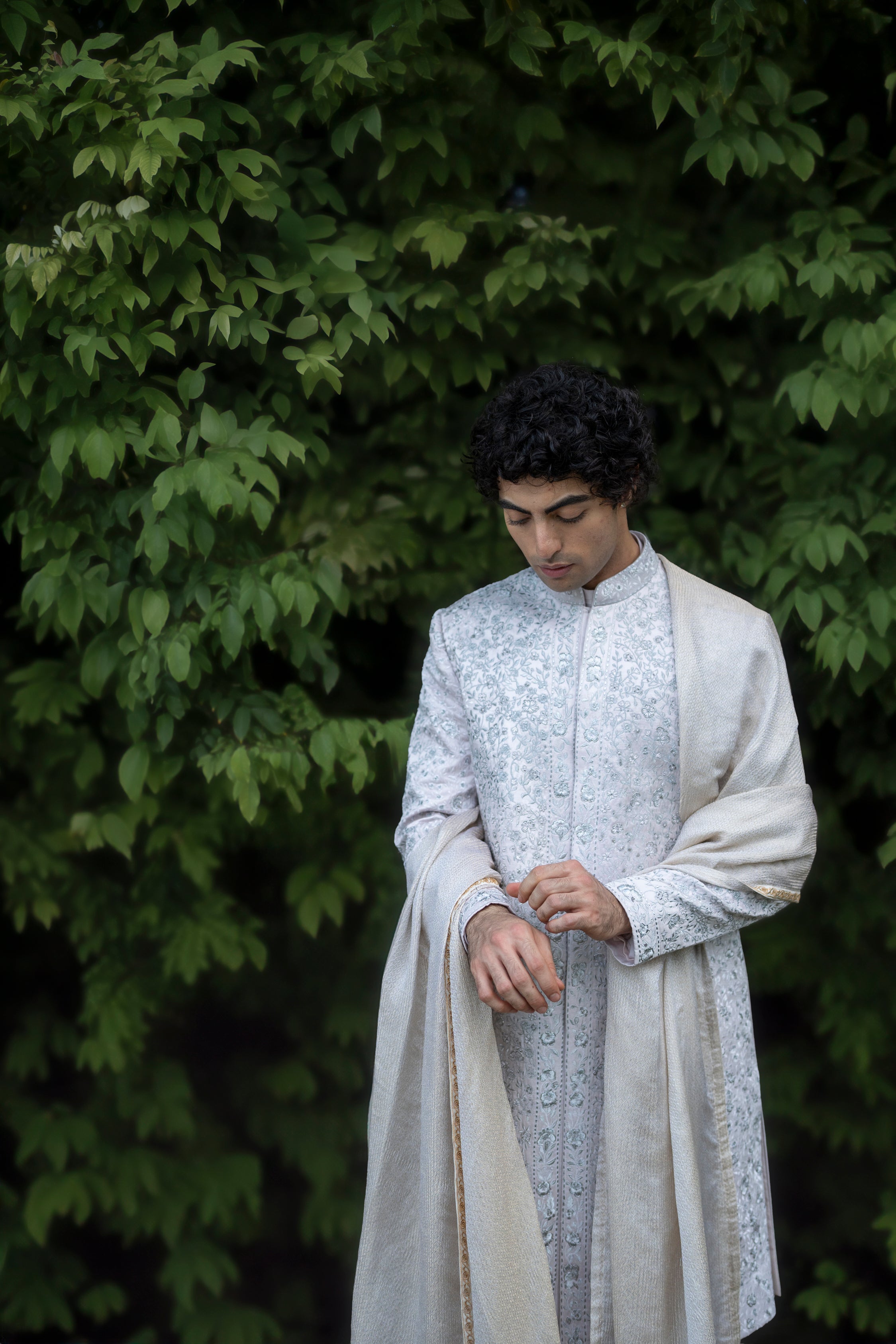 Front view of the Lilac Grey Rose sherwani set, featuring a blend of grey and lilac hues inspired by Monet’s color palette, with intricate hand-embroidered aari and zardozi detailing.