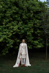 Front view of the Ivory Fleur sherwani made from linen silk, featuring placement embroidery with ivory and champagne threads, sequins, and gold elements