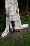 Complete Ivory Fleur sherwani set paired with a coordinating kurta, churidar, stole, and safa for a luxurious and regal look