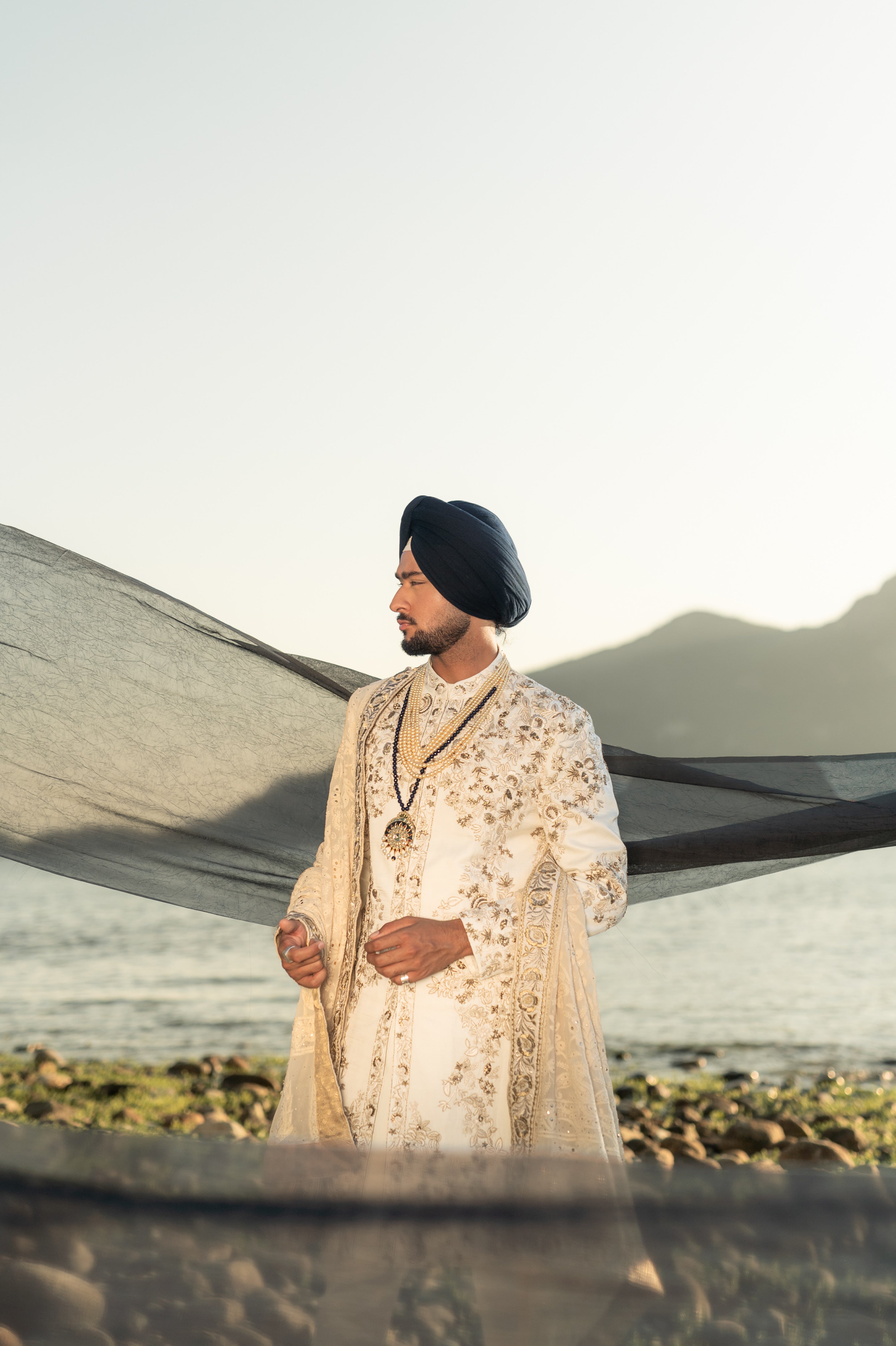 Full outfit of a greyish lilac short jacket set paired with a short-length shirt-style kurta and tapered trousers, creating a chic and modern look