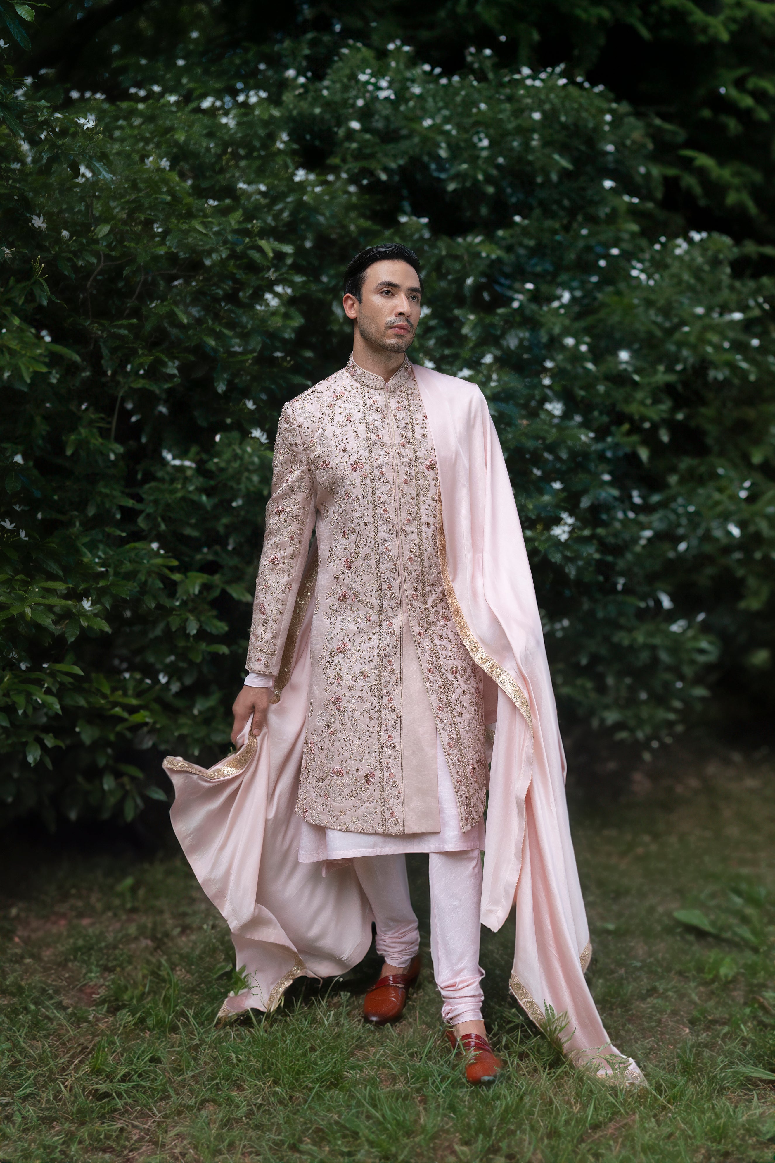 Complete Primerose Sherwani set, showcasing its blush pink tone and exquisite embroidery for a soft yet luxurious look.