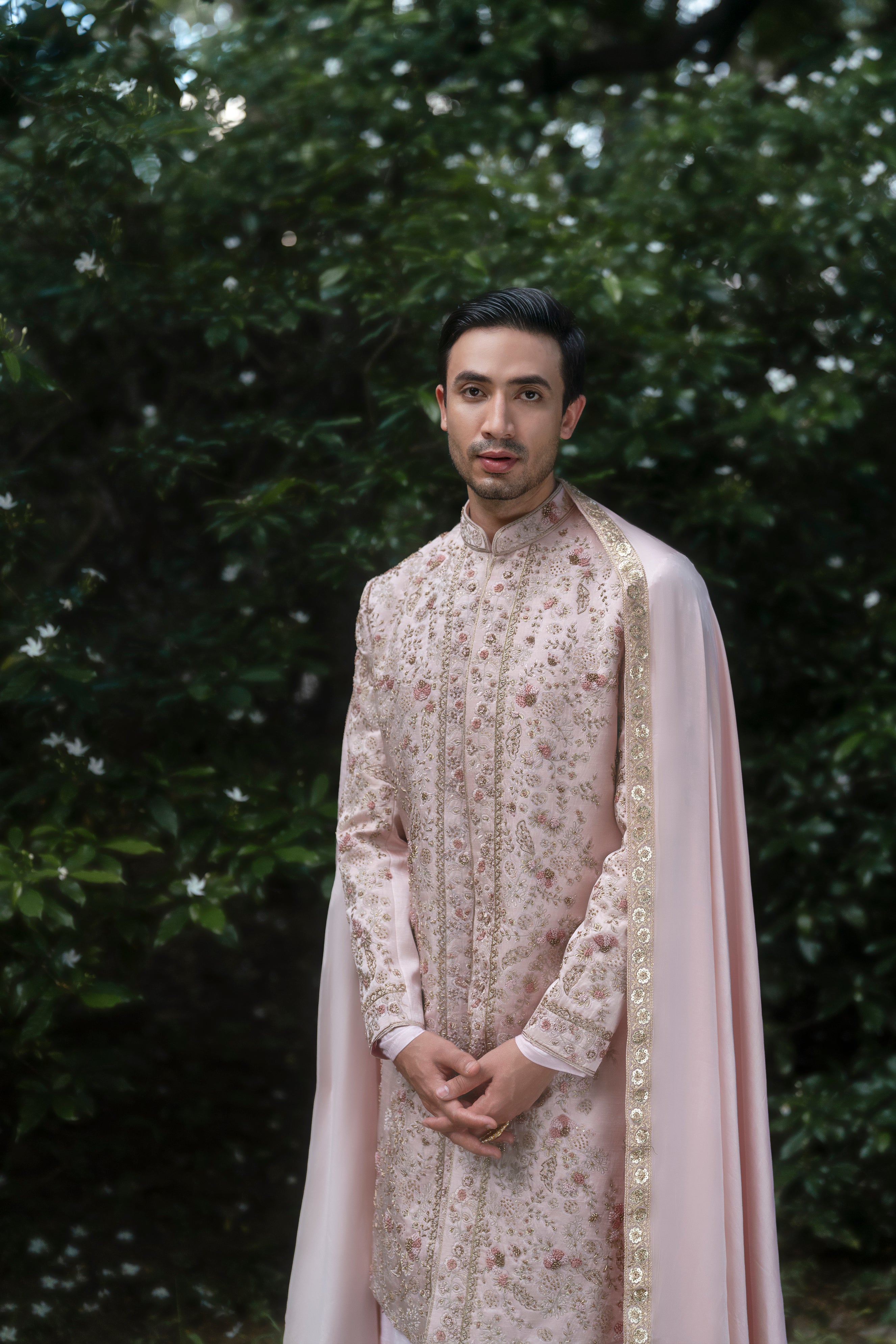 Complete Primerose Sherwani set, showcasing its blush pink tone and exquisite embroidery for a soft yet luxurious look.