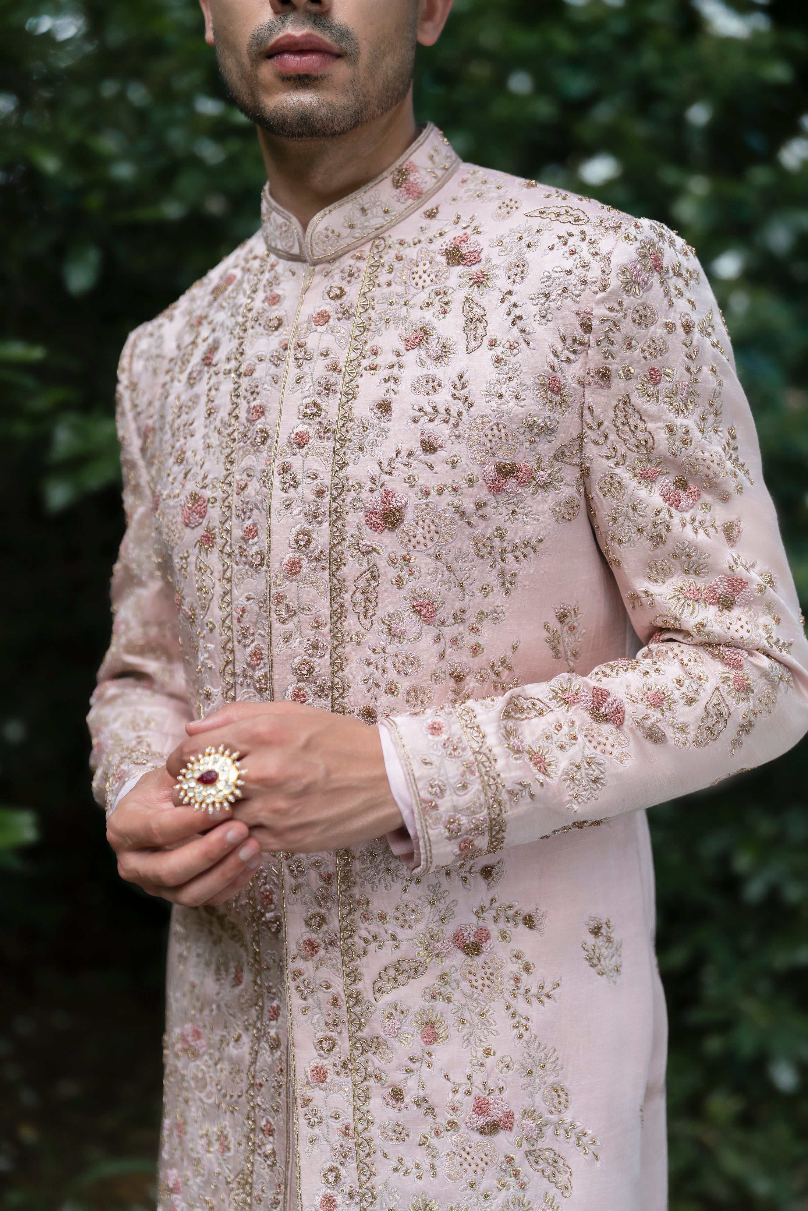 Front view of the Primerose Sherwani in blush pink linen silk, featuring intricate tone-on-tone aari embroidery with highlights of aari and zardosi work